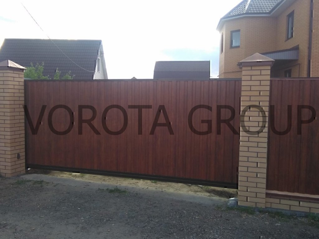 Установка откатных ворот из профлиста под дерево Установка откатных ворот из профлиста под дерево